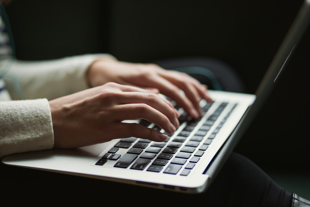 person using laptop to search directory